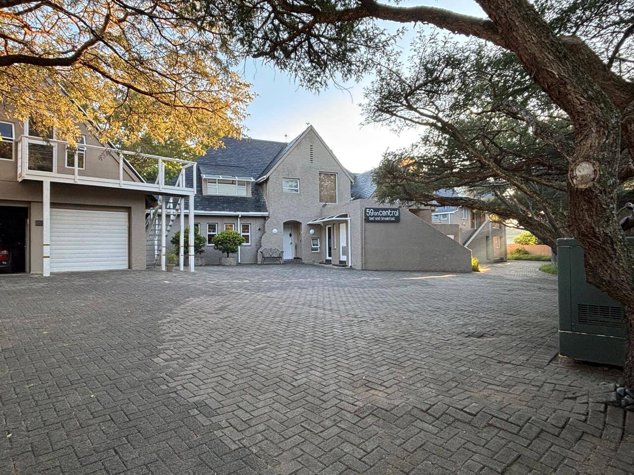 Property exterior with mature tree